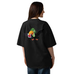 Person wearing a black t-shirt with a colorful parrot design on the back, standing against a white background.