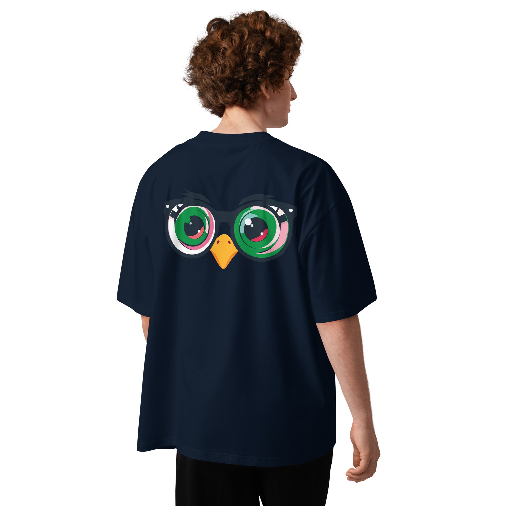 Person wearing a navy blue t-shirt with a colorful owl design on the back, standing against a white background.