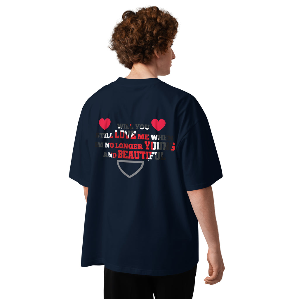 Person wearing a navy blue t-shirt with text and heart designs on the back, on a white background