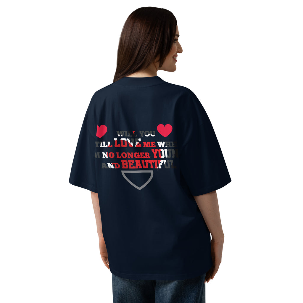 Person wearing a navy blue t-shirt with text and heart designs on the back, on a white background