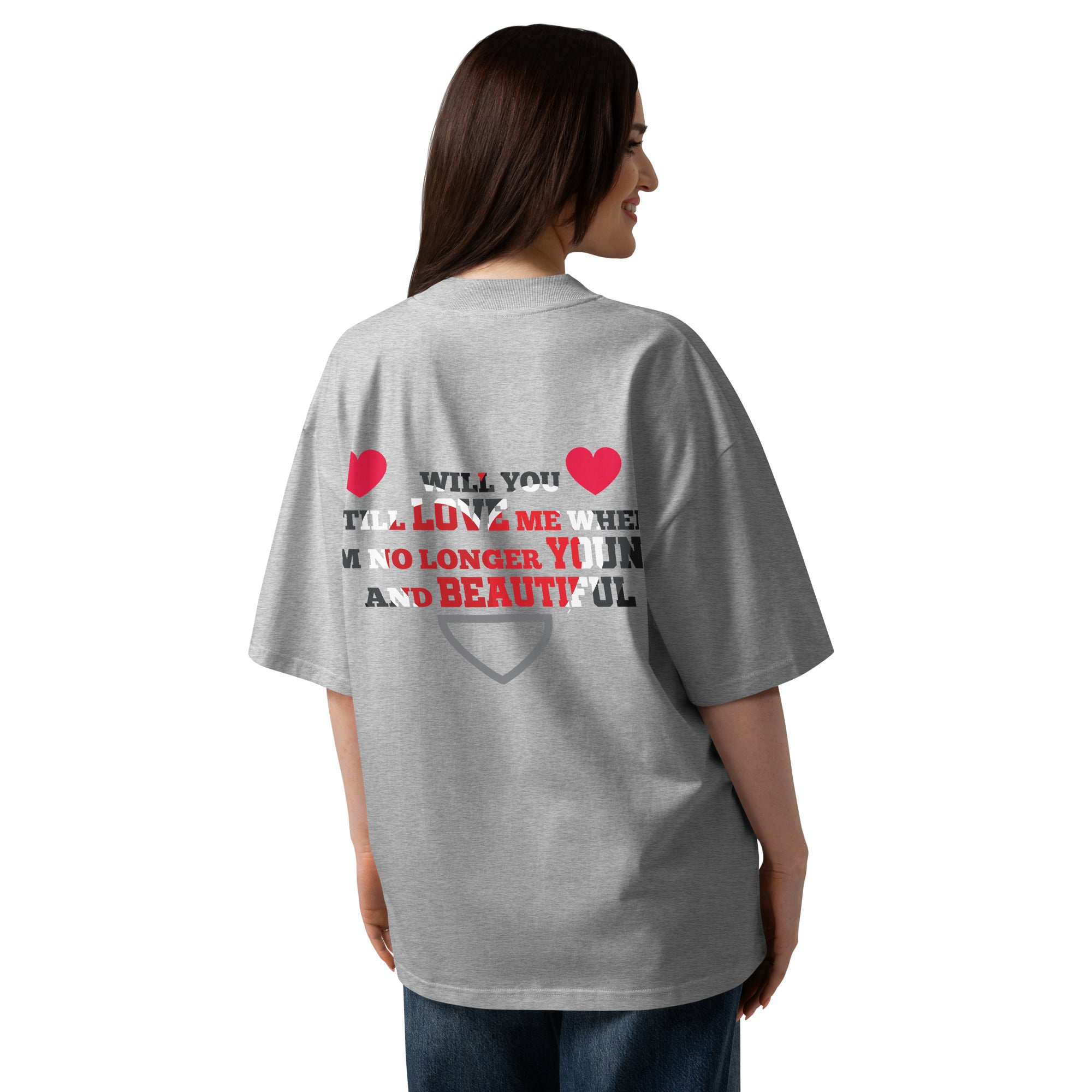 Person wearing a gray t-shirt with text and heart graphics on the back, on a white background