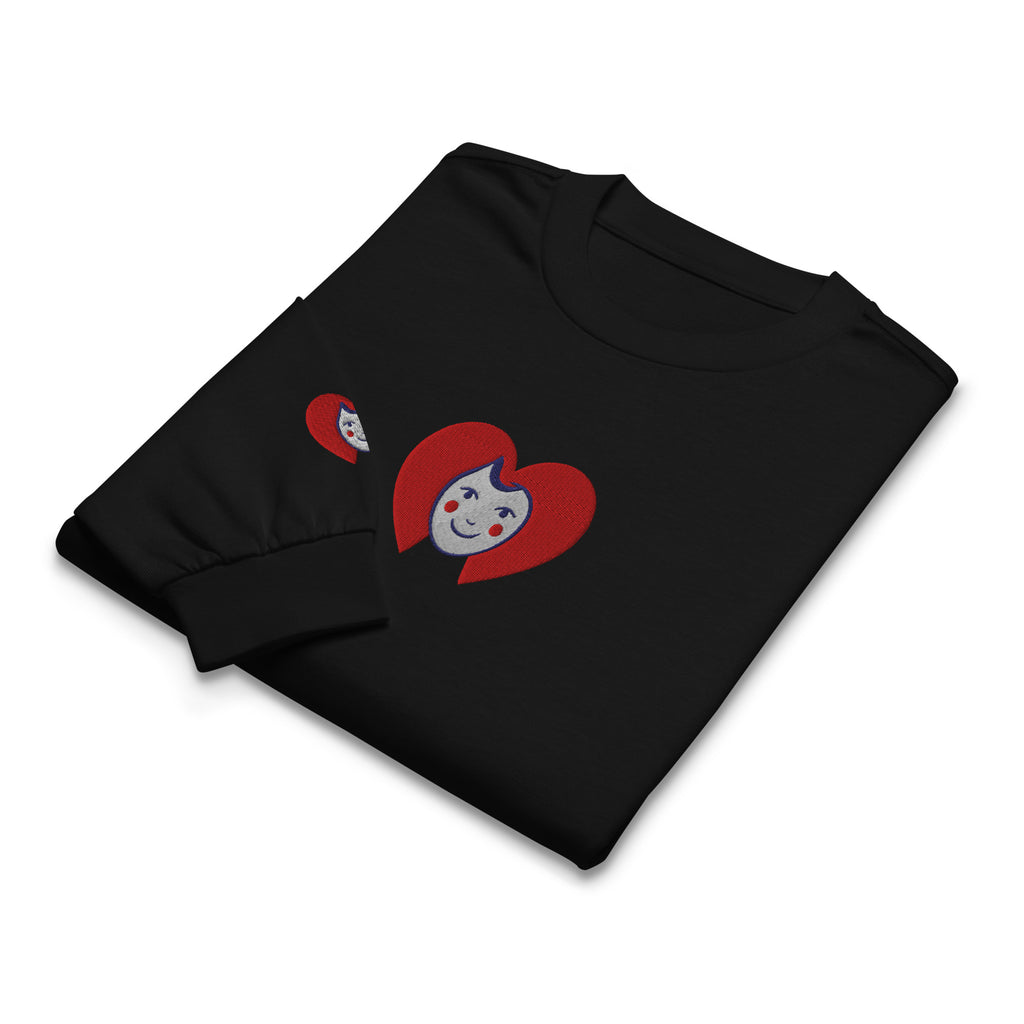Black t-shirt with red heart design featuring a face on a white background