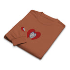 Folded brown t-shirt with cartoon character design on a white background
