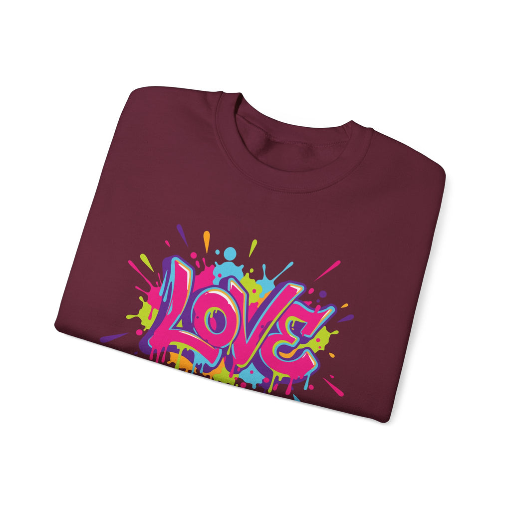 Folded maroon sweatshirt with colorful 'LOVE' graphic on a white background