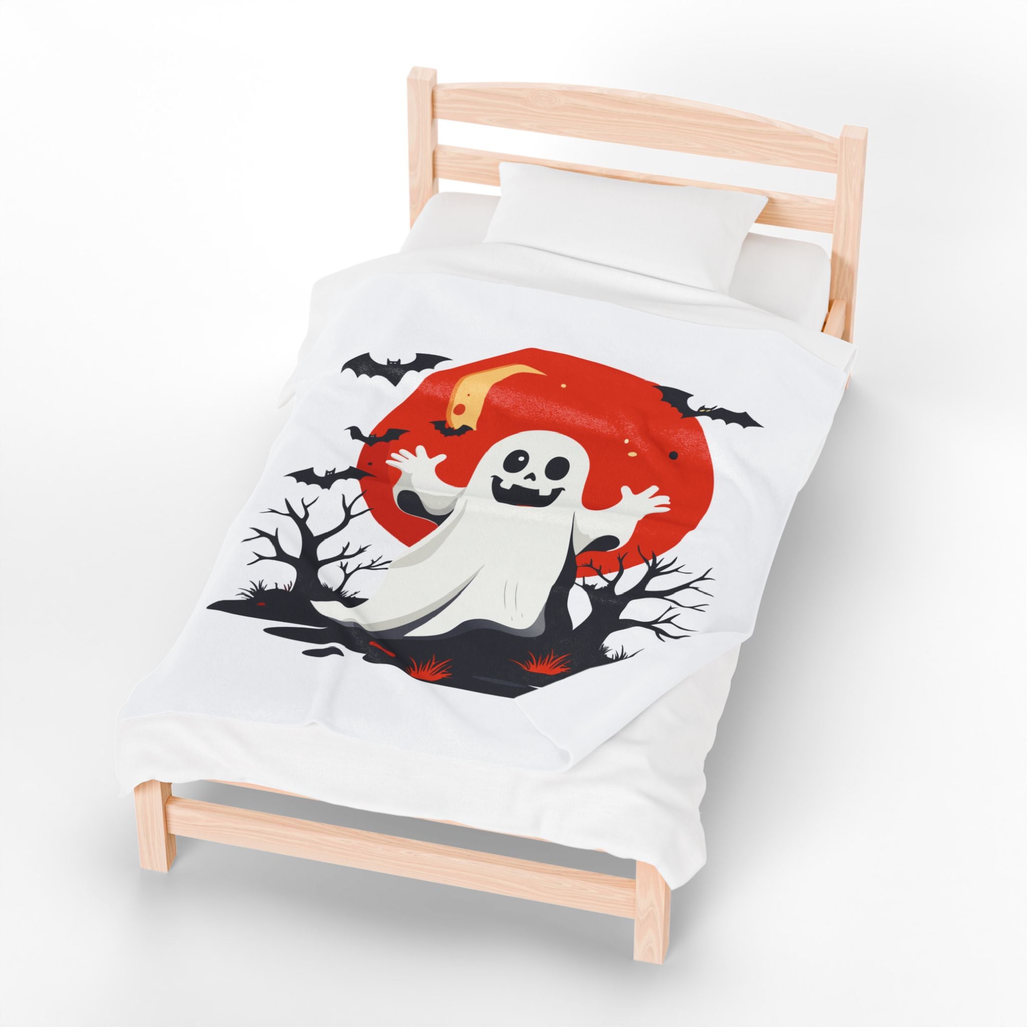 Children's bed with Halloween-themed bedding featuring a ghost and moon design.