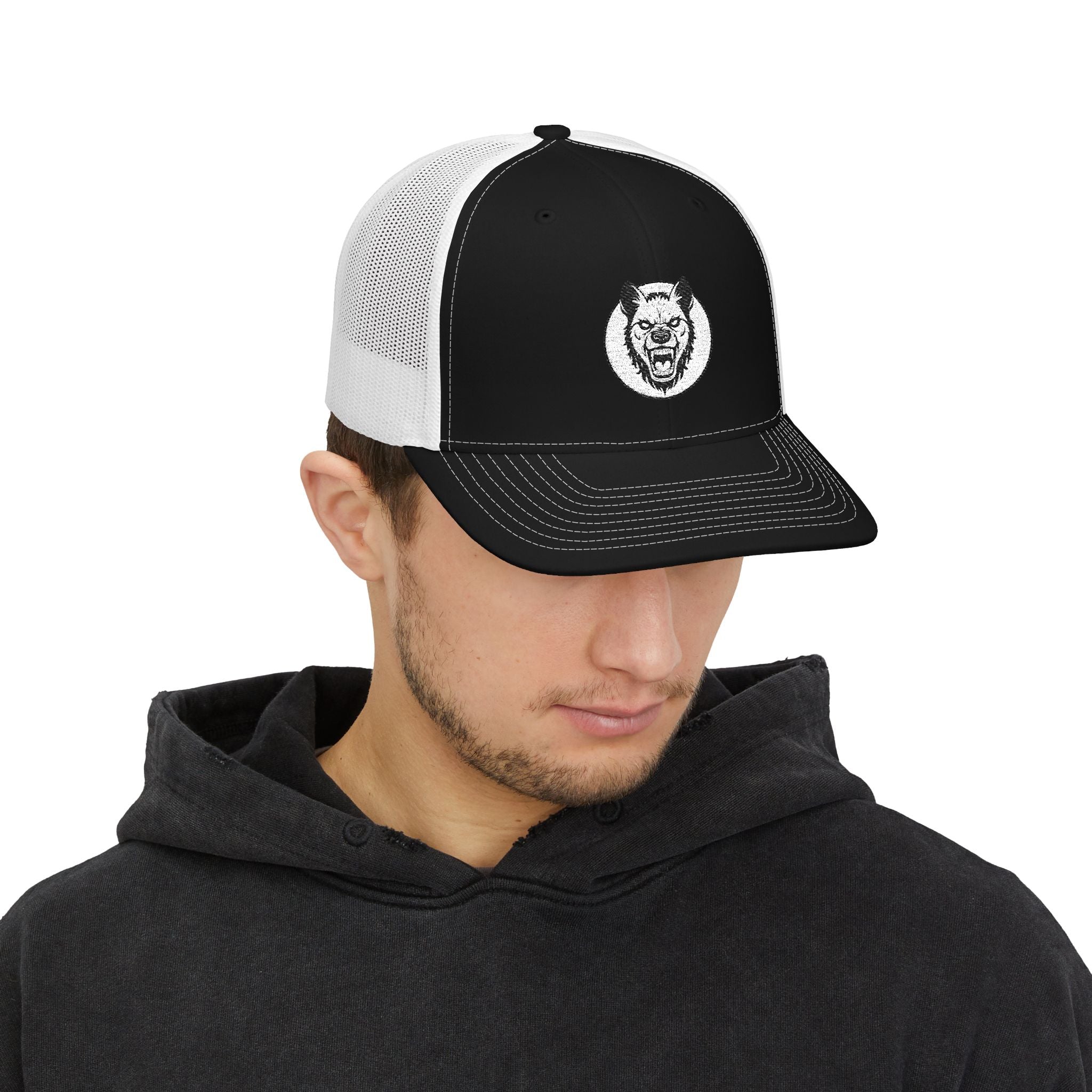 Man wearing a black and white cap with a logo on a white background