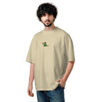 Man wearing a beige t-shirt with a logo on a white background