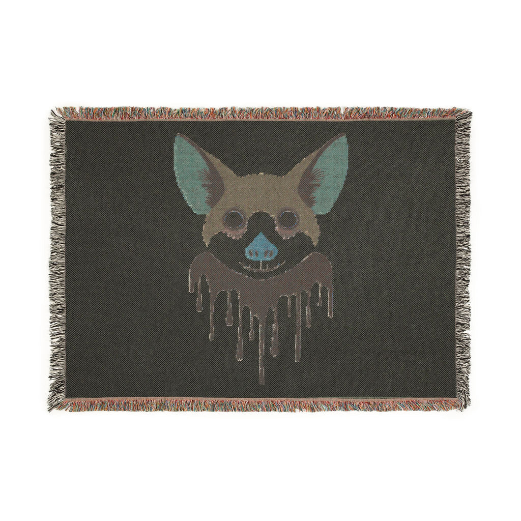 Blanket with a graphic of a dog's face on a black background