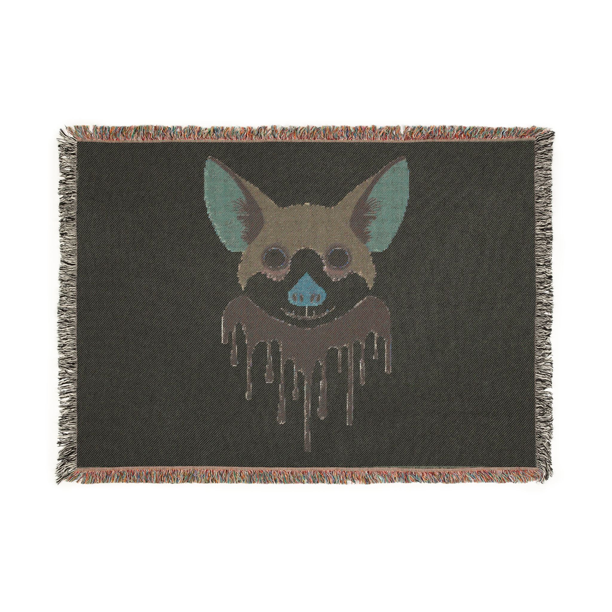 Blanket with a graphic of a dog's face on a black background