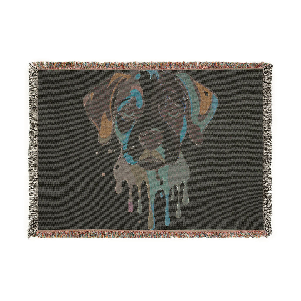 Blanket with a stylized dog face design on a black background