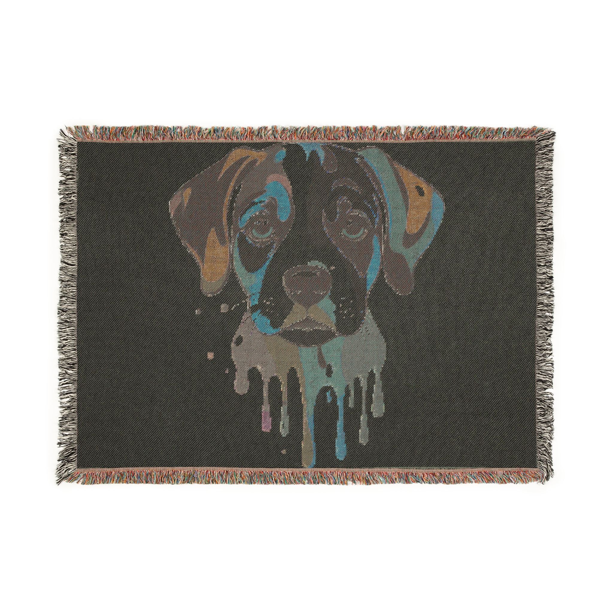 Blanket with a stylized dog face design on a black background